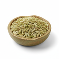 Fennel seeds in a wooden bowl on white background