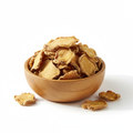 Dried ginger root slices in a wooden bowl on white background