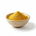 Mustard powder in a ceramic bowl on white background