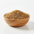 Whole cumin seeds in a wooden bowl on white background