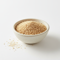 Garlic granules in a ceramic bowl on white background